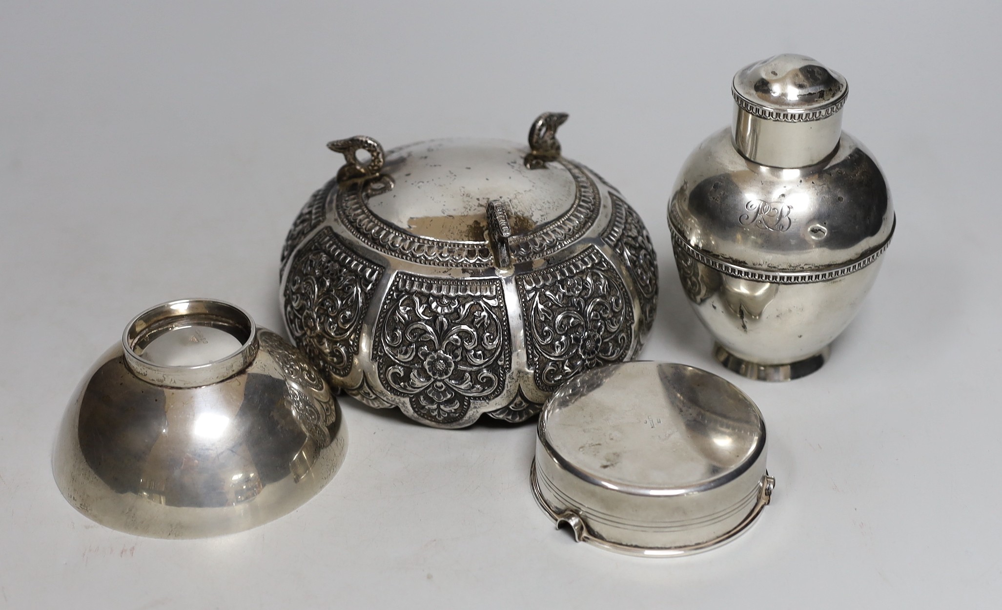 An Indian embossed white metal bowl, diameter 12.9cm, a George V silver tea caddy?, a modern silver Links of London small bowl and an 800 white metal ashtray.